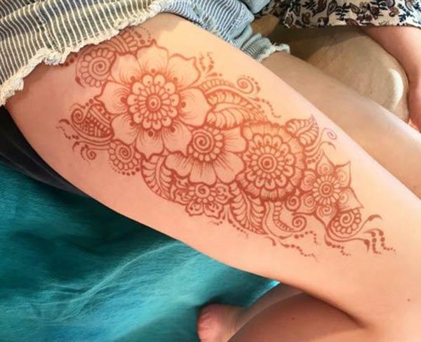 flowers and paisley mehndi design for thighs