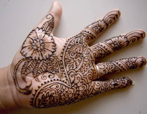 Floral and Paisley Mehndi Design on Palm for Women