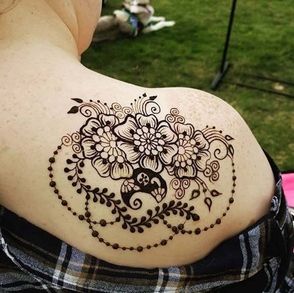 A beguiling floral shoulder mehendi design for Girls and ladies