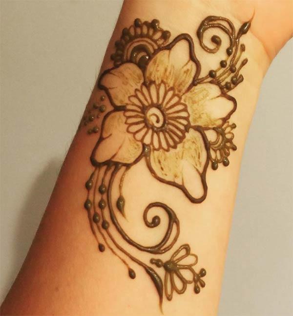 flowers and swirls mehndi design for wrist