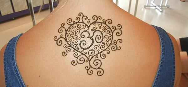 heart with Om symbol mehndi design for back