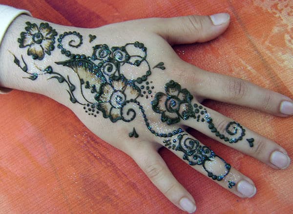 floral Mehandi design on back hand 