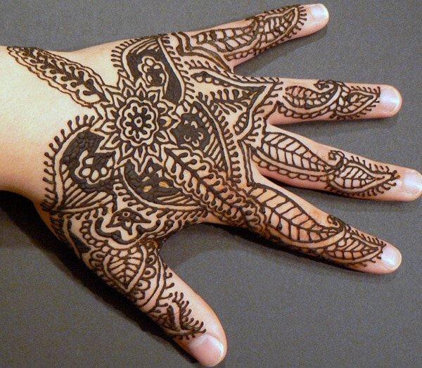 floral and paisley traditional Mehndi design on hand 