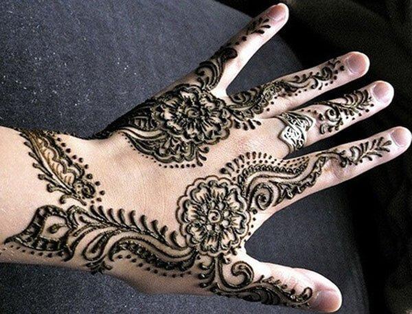 floral Mehendi design on back hand 