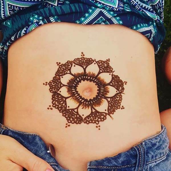 A graceful mehendi design on stomach for Ladies