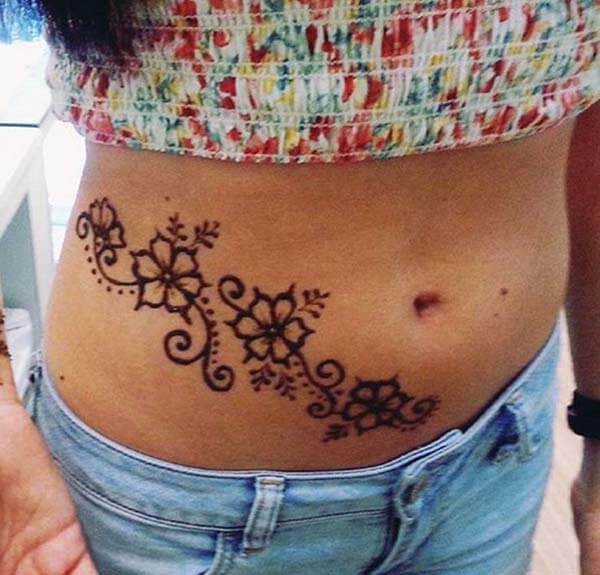 A simple cute mehendi design on stomach for girls