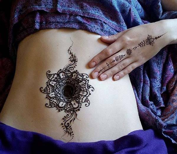 A pleasing mehndi design on stomach for Girls and woman