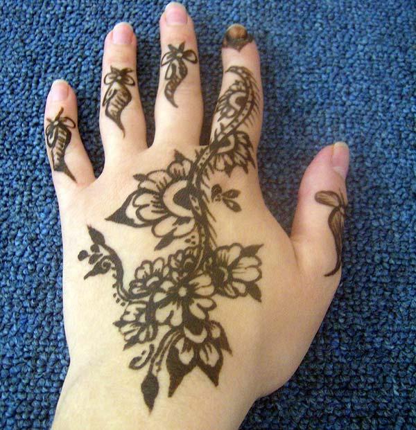 A pretty mehndi design on back hand for girls and women