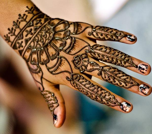 A delightful mehendi design on back hand for Girls