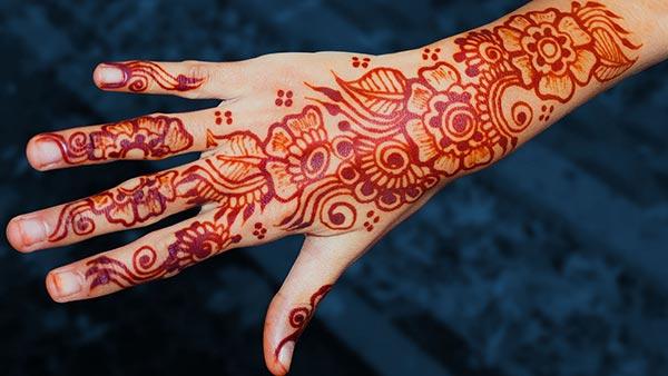 A heavenly mehndi design on back hand for Girls