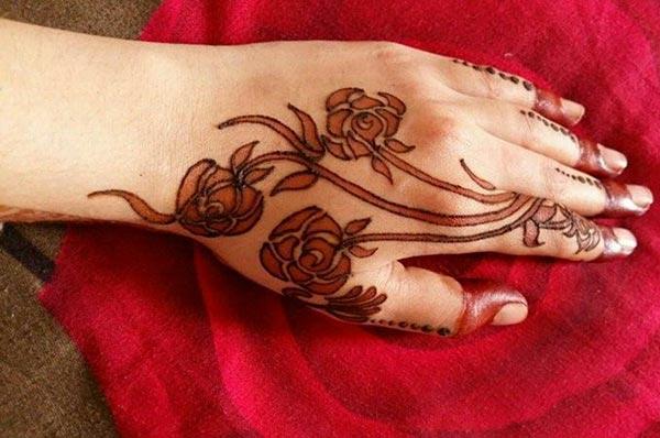 Rose mehndi design on back hand for Women