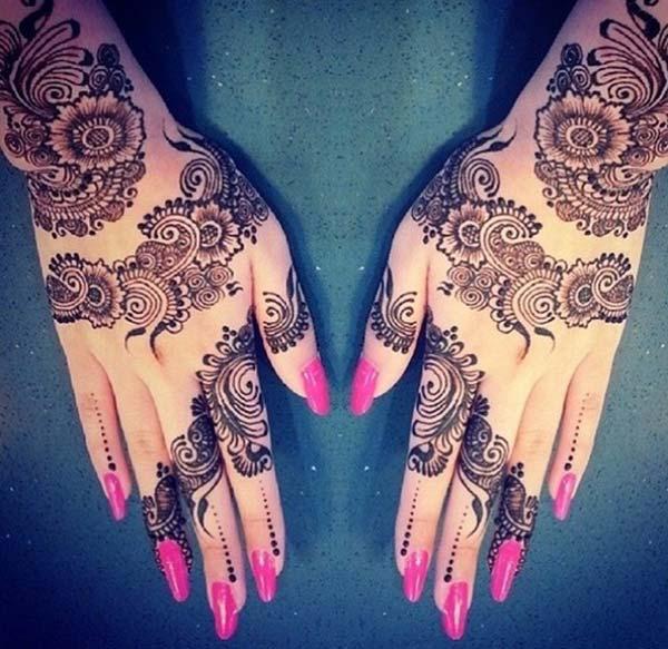 A striking back hand mehndi design for girls and ladies