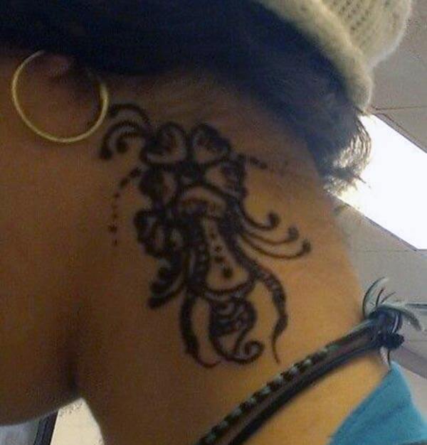 A floral mehendi design on neck for Girls