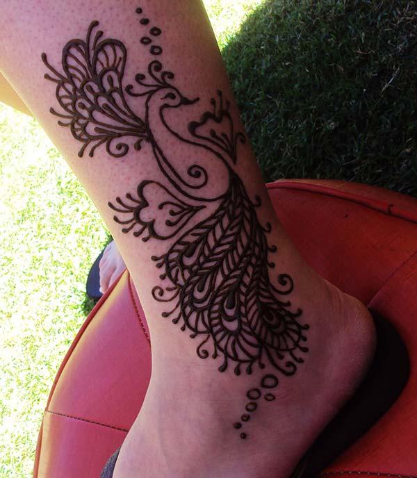 Embrace the peacock love with this ankle mehendi design for Women