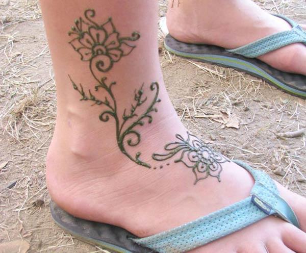 A lovely floral mehendi design on ankle for Ladies