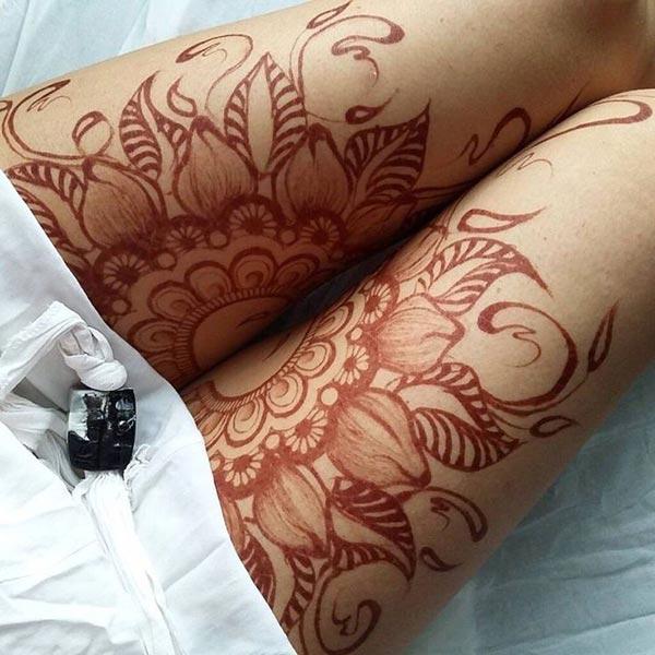 A split mandala mehendi design on thigh for Girls