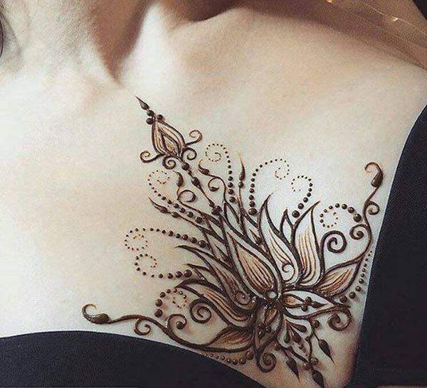 A sexy lotus mehendi design on chest for girls and women