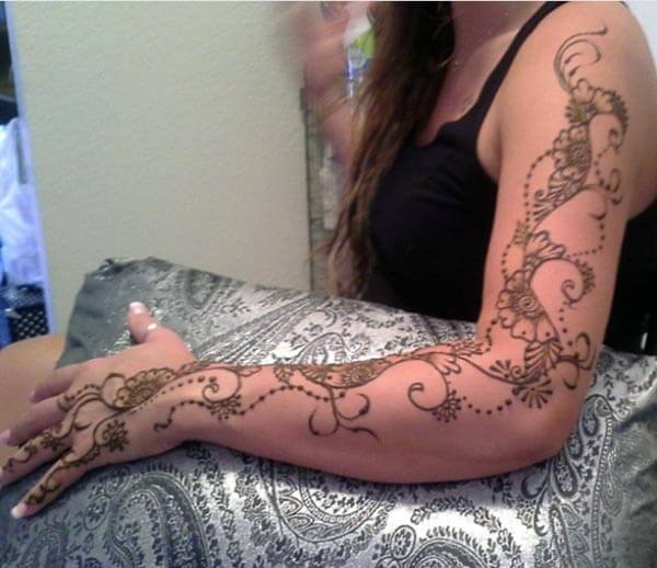 A floral vine mehndi design on full arm for girls and ladies