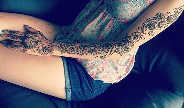 A heavenly mehendi design on full arm for girls and women