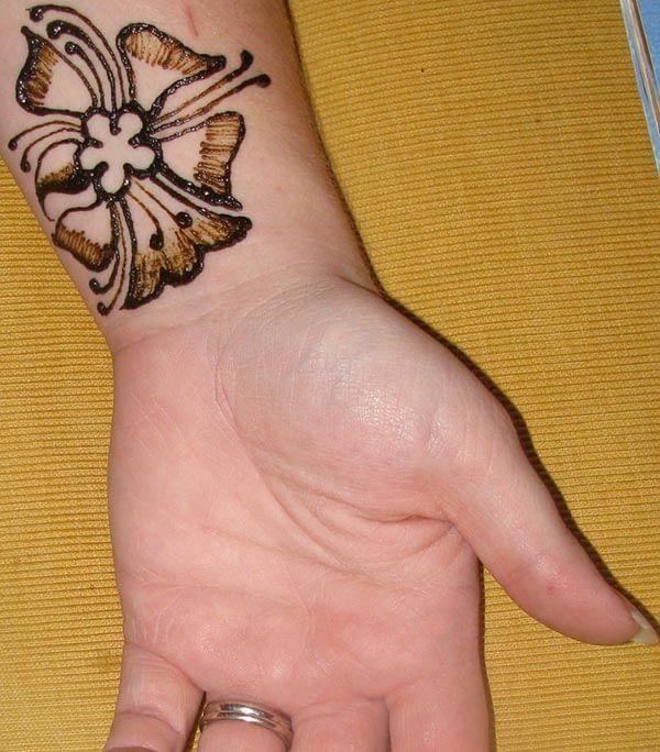 A cute mehendi design on wrist for Women