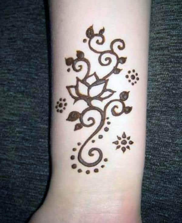 A pretty floral wrist mehendi design for girls